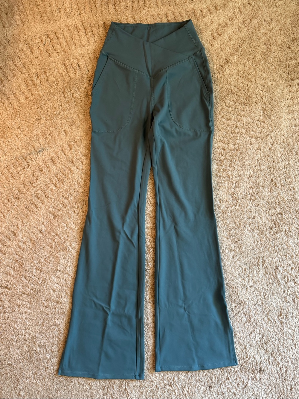 Halara High-Waisted Crossover Flare Leggings in a Teal color. Size XS. NWT.